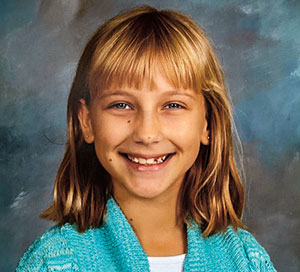 a young girl smiling
