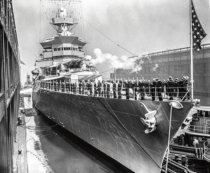 enlargeable black and white photo of a large ship with sailors on it