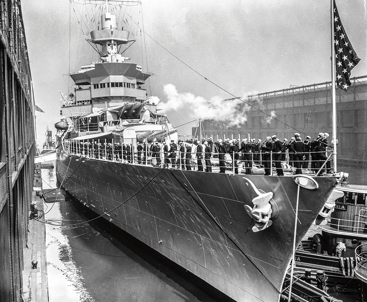 black and white photo of a large ship with sailors on it
