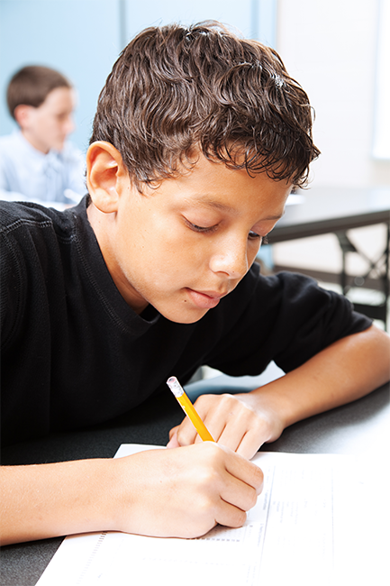 a student writing with a pencil