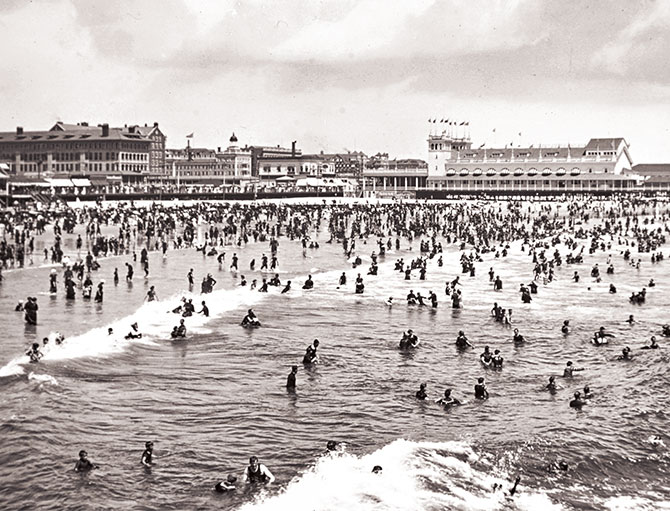 Enlargeable black and white photo of crowds enjoying a day at the beach